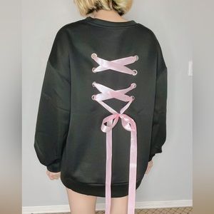 BRAND NEW! Black sweater with pink bow in the back